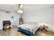 Spacious bedroom with a ceiling fan and hanging chair at 1655 58Th S Ter # 1, St Petersburg, FL 33712