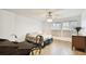 Bedroom with floral bedding, ceiling fan, and wooden desk at 1655 58Th S Ter # 1, St Petersburg, FL 33712