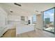 Modern white kitchen with island, stainless steel appliances, and city views at 301 1St S St # 1903, St Petersburg, FL 33701