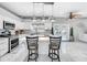 Modern kitchen with white cabinets and island at 12506 Ashdown Dr, Odessa, FL 33556