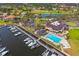 Aerial view of a marina, clubhouse, and golf course at 2829 Skimmer Point S Dr, Gulfport, FL 33707