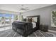 Main bedroom with water views and luxurious bedding at 2829 Skimmer Point S Dr, Gulfport, FL 33707