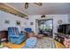 Relaxing living room with comfortable seating and sliding glass doors at 3843 Damian Dr, Zephyrhills, FL 33541