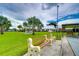 Landscaped lawn with gazebo and park bench at 3843 Damian Dr, Zephyrhills, FL 33541
