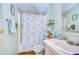 Bathroom with shower, toilet and a vanity with storage at 3843 Damian Dr, Zephyrhills, FL 33541