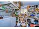 Laundry room with washer, dryer, and ample storage shelves at 3843 Damian Dr, Zephyrhills, FL 33541