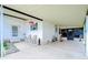 Covered patio with seating area and storage at 3843 Damian Dr, Zephyrhills, FL 33541