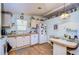 Bright kitchen with light-colored cabinets and a breakfast nook at 3843 Damian Dr, Zephyrhills, FL 33541