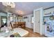 Charming dining area with a wood table and hutch at 3843 Damian Dr, Zephyrhills, FL 33541