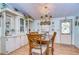 Elegant dining area, featuring a formal table setting and hutch at 3843 Damian Dr, Zephyrhills, FL 33541