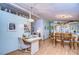 Bright dining room with a wooden table and chairs at 3843 Damian Dr, Zephyrhills, FL 33541