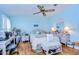 Bright bedroom with a queen-size bed, and a workspace at 3843 Damian Dr, Zephyrhills, FL 33541