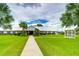 Ranch-style clubhouse with lush landscaping and gazebo at 3843 Damian Dr, Zephyrhills, FL 33541
