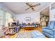Bright living room with hardwood floors and ample seating at 3843 Damian Dr, Zephyrhills, FL 33541