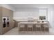 Modern kitchen with island and marble countertops at 1028 Sunset Point Rd # R10, Clearwater, FL 33755