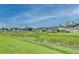 View of a neighborhood with lush green landscape at 7110 Moss Ledge Run, Land O Lakes, FL 34637