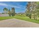 Spacious backyard with a patio and mature trees at 7110 Moss Ledge Run, Land O Lakes, FL 34637