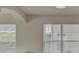 Bright dining room with large windows and neutral walls at 7110 Moss Ledge Run, Land O Lakes, FL 34637