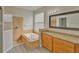 Bathroom boasts granite countertops, a garden tub, and a separate shower at 7110 Moss Ledge Run, Land O Lakes, FL 34637