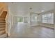 Spacious living room with hardwood floors and stairs at 7110 Moss Ledge Run, Land O Lakes, FL 34637