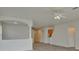 Open living room with vaulted ceiling, neutral walls, and hardwood floor at 7110 Moss Ledge Run, Land O Lakes, FL 34637
