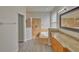 Bathroom features granite countertops, a garden tub, and a separate shower at 7110 Moss Ledge Run, Land O Lakes, FL 34637