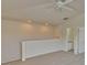 Spacious bonus room with carpeted floors and vaulted ceiling at 7110 Moss Ledge Run, Land O Lakes, FL 34637