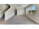 Living room with carpeted floor, ceiling fan, and large windows at 9118 Mountain Magnolia Dr, Riverview, FL 33578