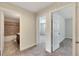 Hallway with carpet flooring, leading to bedrooms and a bathroom at 9118 Mountain Magnolia Dr, Riverview, FL 33578