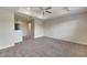 Large bedroom with plush carpeting and an open loft area at 9118 Mountain Magnolia Dr, Riverview, FL 33578