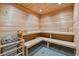 Clean and modern sauna with wooden benches and heater at 1028 Sunset Point Rd # R8, Clearwater, FL 33755