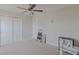 Well-lit bedroom with double doors and closet at 10215 Count Fleet Dr, Ruskin, FL 33573