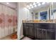 Bathroom with granite countertops and double sinks at 10215 Count Fleet Dr, Ruskin, FL 33573