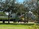 Community playground with playset and bench at 10215 Count Fleet Dr, Ruskin, FL 33573