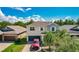 Two-story house with attached garage and driveway at 10215 Count Fleet Dr, Ruskin, FL 33573