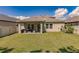 Large backyard featuring a covered patio at 10215 Count Fleet Dr, Ruskin, FL 33573