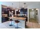 Spacious kitchen with island, granite countertops, and stainless steel appliances at 10215 Count Fleet Dr, Ruskin, FL 33573