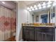 Bathroom with granite countertops and double sinks at 10215 Count Fleet Dr, Ruskin, FL 33573