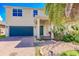 Two-story house with a brick driveway and landscaped yard at 10215 Count Fleet Dr, Ruskin, FL 33573