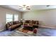 Living room with hardwood floors and ample natural light at 10215 Count Fleet Dr, Ruskin, FL 33573