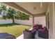 Relaxing covered patio with outdoor furniture at 10215 Count Fleet Dr, Ruskin, FL 33573