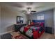 Bedroom with a bed, dresser, and ceiling fan at 10215 Count Fleet Dr, Ruskin, FL 33573
