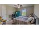 Bedroom with a bed, dresser, and ceiling fan at 10215 Count Fleet Dr, Ruskin, FL 33573