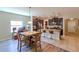 Kitchen features a breakfast bar and dining area with adjacent Gathering room at 10215 Count Fleet Dr, Ruskin, FL 33573