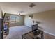 Spacious bonus room with large window and carpeted floor at 10215 Count Fleet Dr, Ruskin, FL 33573