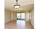 Bright and airy dining room with sliding glass doors leading to the outdoors at 11790 Fennemore Way, Parrish, FL 34219