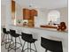 Kitchen features granite countertop, bar seating and white appliances at 4251 Preserve Pl, Palm Harbor, FL 34685