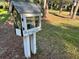 A charming Little Free Library with an inviting design, encouraging community engagement and literacy at 4251 Preserve Pl, Palm Harbor, FL 34685