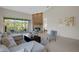Inviting living room with ample light, a fireplace, and comfortable seating with a view of the balcony at 4251 Preserve Pl, Palm Harbor, FL 34685