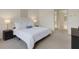 Comfortable main bedroom featuring neutral decor and a closet across from the ensuite bathroom at 4251 Preserve Pl, Palm Harbor, FL 34685